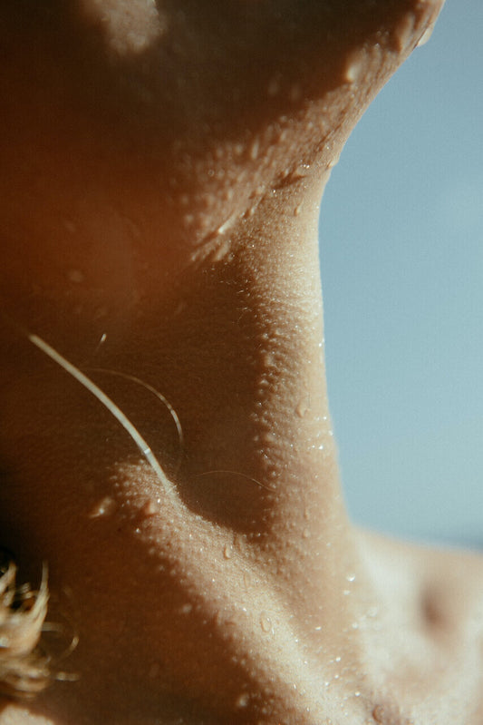 close up of water droplets on sun kissed skin