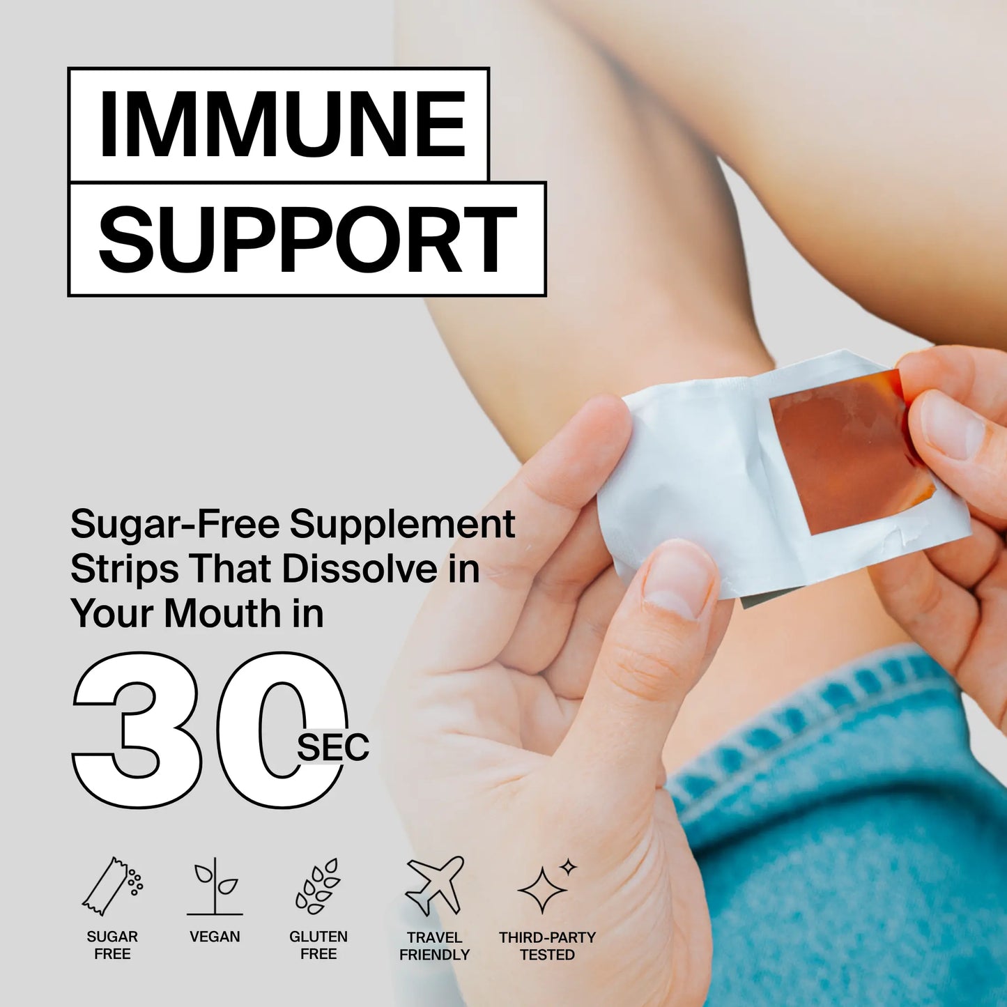 Sugar-free supplement strip being held with text about immune support and product features.