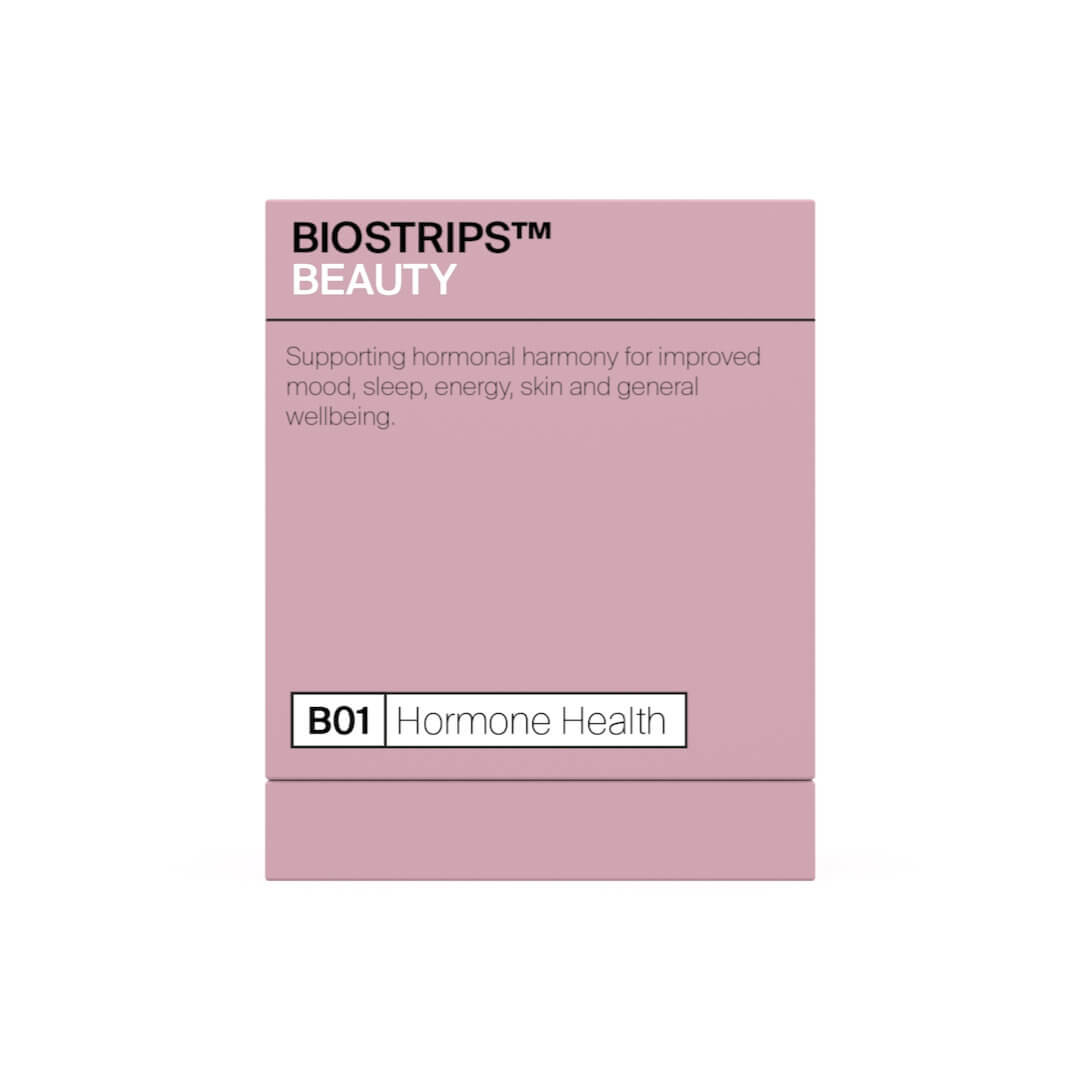 A plain pink box of BIOSTRIPS™ BEAUTY, with text stating support for hormonal harmony and overall wellbeing, designated as B01 Hormone Health.