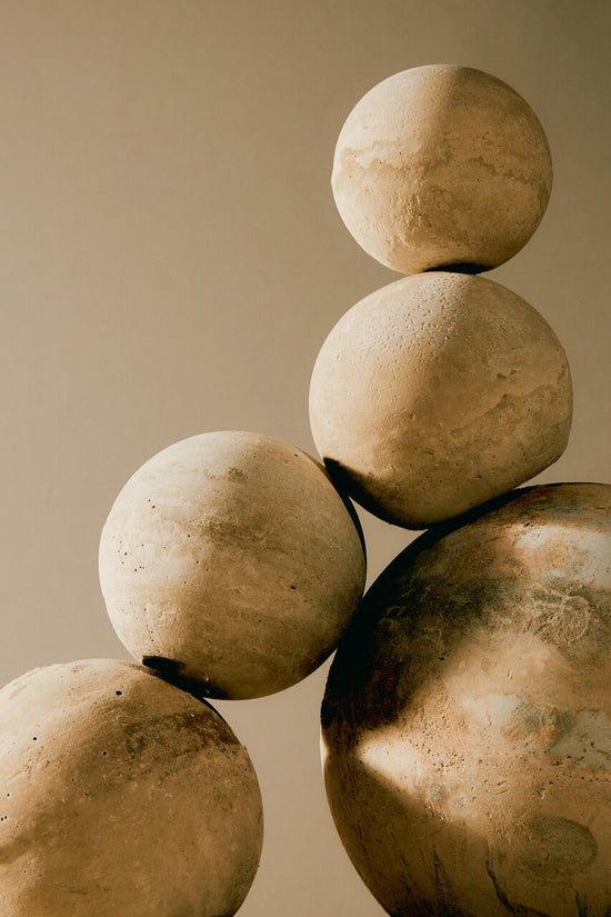 Earthy concrete balls balanced together