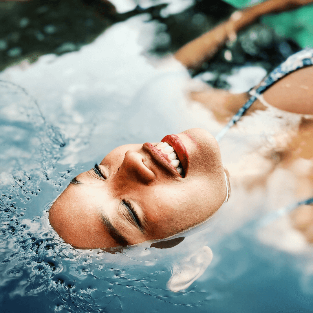 natural beauty floating in water with smile on face