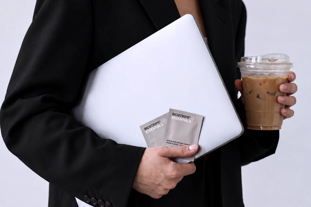 Single-serve BIOSTRIPS strip sachet held in hand as part of a daily routine